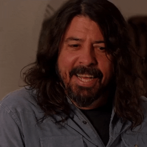Celebrity gif. Dave Grohl shakes his head and nods, saying, "Yeah, it's so good. It's killer."