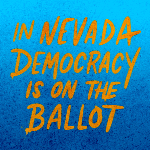 Text gif. Handwritten capitalized text against bright blue background reads, “In Nevada democracy is on the ballot.” A hand holding a can of yellow spray paint underlines the word, “Nevada.”