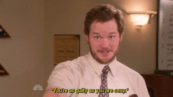Parks and Recreation gif. Chris Pratt as Andy reaches out with wide eyes as he says, "You're as guilty as you are sexy."