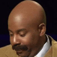 SNL gif. Comedian Kenan Thompson dressed as Steve Harvey makes the TV host's signature shocked facial expression. 