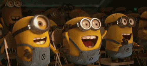  Excited Minions cheer enthusiastically at an unseen performer during a show or concert
