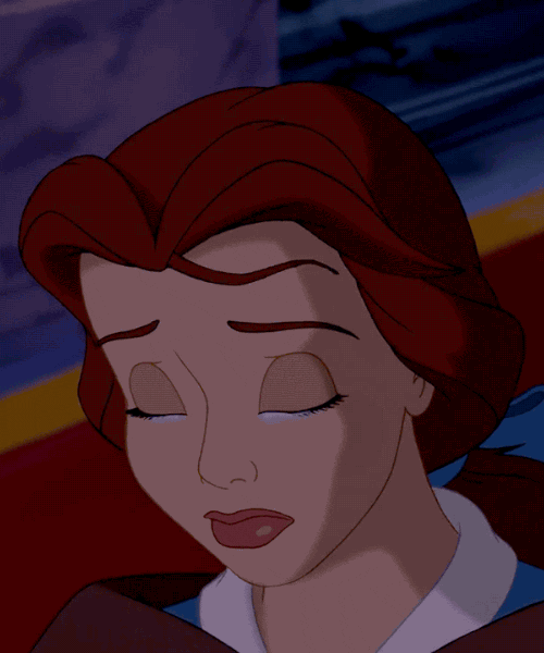 Disney gif. Belle in the cartoon Beauty and the Beast looks down with her eyes closed as a teardrop falls down her cheek. 