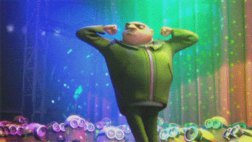 Movie gif. Gru from Despicable Me pumps his elbows together from the side of his head under neon lights as dozens of minions admire him from below.