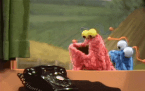 Sesame Street gif. The Martians stare curiously at a telephone, then the pink one shakes their head and backs away. Text, "Nope nope nope."