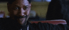 Movie gif. Denzel Washington in Training Day sits in a booth at a restaurant, leaning back in his chair. Shaking his head a bit, he says, “boom.” and then gives a very smug smile as if he’s won.