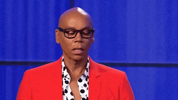 Celebrity gif. RuPaul looks off screen and speaks with glowing words that come on screen. Text, "This is next level gay shit."