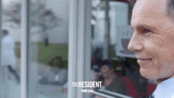 the resident smile GIF