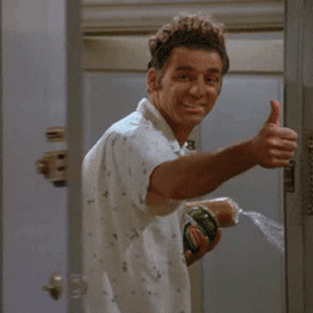 Seinfeld gif. Michael Richards as Kramer looks back, smiling, as he walks out the door, which is about to close on his hand giving a thumbs up.