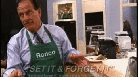 Man with Ronco apron saying "Set it & Forget it" to audience