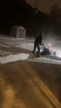 Green Bay Resident Clears Snow Amid Winter Storm