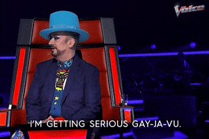 TV gif. Wearing a baby blue top hat and blue suit, Boy George on The Voice Australia says solemnly, “I'm getting serious gay-ja-vu.”