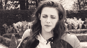 Celebrity gif. Kristen Stewart bewilderedly gestures to herself and asks, "Really?" with a sarcastic smile upon her face.