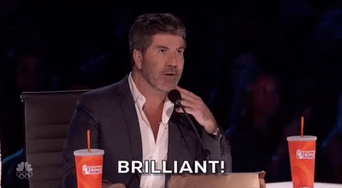 Reality TV gif. Simon Cowell as a judge on America's Got Talent raises both of his hands and sincerely declares, "Brilliant!"
