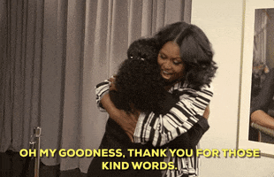 Celebrity gif. Michelle Obama hugs a woman tight as she says, “Oh my goodness, thank you for those kind words.”