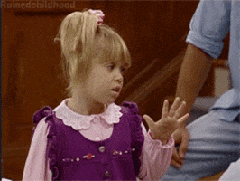 TV gif. One of the Olsen twins as Michelle from Full House holds up her hand like whatever and sassily turns away while rolling her eyes.