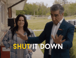 Schitt's Creek gif. Eugene Levy as Johnny holds up both palms and says, "Shut it down," while Emily Hampshire as Stevie smiles skeptically in the background.