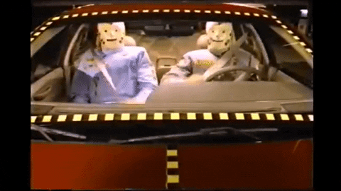 Crash test dummies buckling seatbelts