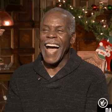 Celebrity gif. Danny Glover leans his head back, laughing with his mouth wide and eyes closed. He doubles over, clapping his hands together as he cracks up. 
