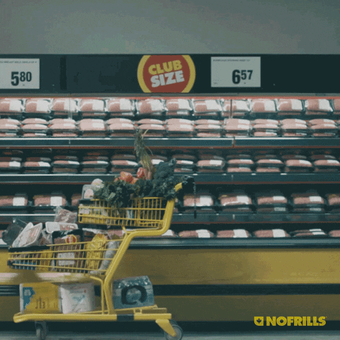 Ad gif. In a No Frills ad, a woman flies in the air and dunks a bag of chips into her shopping cart. In capital letters is the text, “SCORE.”