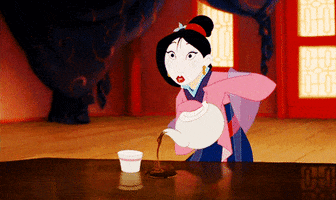Disney gif. Mulan in a full face of makeup holds a teapot in her hands. She has a shocked expression on her face and blanks out, not realizing she’s not pouring the tea into the cup, but next to it. 