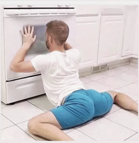 Man Checking Oven GIF