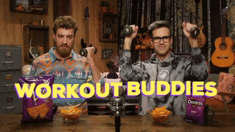 Gym workout partners celebrating after nailing their nutrition and training plan together