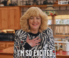 TV gif. Wendi McLendon-Covey as Beverly in The Goldbergs closes her eyes and shakes her fist in excitement and says, “I'm so excited!”