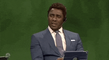 SNL gif. Wearing a headset and appearing as an announcer, Idris Elba nods his head and glances offscreen, saying, "Yeah." His name and title flash across the screen, "Dave 'The Bruiser' Koosman."