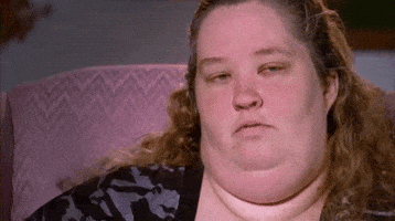 Celebrity gif. Mama June of Here Comes Honey Boo Boo blows a seductive kiss at the camera and smiles.