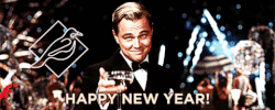 Movie gif. Leonardo Dicaprio as Jay Gatsby in The Great Gatsby holds a martini class up with a smug smile on his face. Fireworks go off behind him. Text, “Happy new year!”