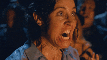 TV gif. Brooke Dillman as Karen in Wrecked screams, baring her teeth.