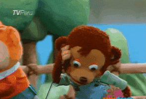 Video gif. Eyes wide in disbelief, a shocked monkey puppet turns towards us with his mouth open.