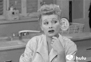 TV gif. Lucille Ball as Lucy and Desi Arnaz as Ricky on I Love Lucy put their hands to their chins and look at each other, one after the other. Lucy looks thoughtful, perhaps suspicious. Ricky looks uncomfortable. 