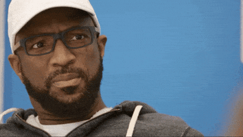 Reality TV gif. Rickey Smiley on Real Housewives of Atlanta is speechless, looking stunned, frowning with his eyes wide and blinking. 