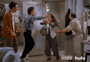 Seinfeld gif. Julia Louis-Dreyfus as Elaine jumps into Jerry's arms as she enters his apartment, then runs to Jason Alexander as George and Michael Richards as Kramer to hug them.