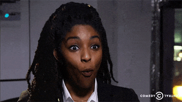 TV gif. Jessica Williams is on the Daily Show with Trevor Noah. She looks completely shocked as she grins and drops her jaw, staring at us open-mouthed but excited.