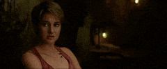 Movie gif. Shailene Woodley as Tris in Divergent blinks in annoyance and turns to face away.