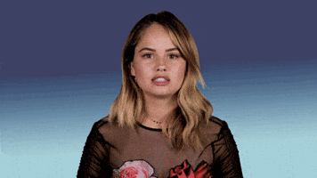 Celebrity gif. Against a blue gradient background, Debby Ryan nods and gestures to us in agreement. Text, "Same" (repeated once).