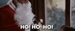 Movie gif. Mekhi Phifer as Gerald in This Christmas, dressed up as Santa Claus, gives a hearty "ho, ho, ho!" and then smiles and raises his hand to say hello