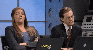 SNL gif. Cecily Strong and Alex Moffat are wearing suits and sitting in front of laptops. Cecily crosses her arms across her chest and skeptically says, "Really," and while Alex closes his eyes, rolls his head around, and he raises his eyebrows.