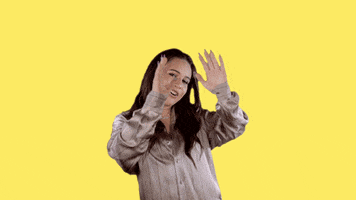 Celebrity gif. Bea Miller moves her hands over her head to show off the text and sparkles that appear above her head, and then shakes her hands with a smile. She says, “Good morning.”
