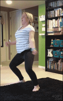 Video gif. Woman dances, wiggling her hips and chest. She bends down, pooping her butt out, accidentally knocking her toddler down with her butt.