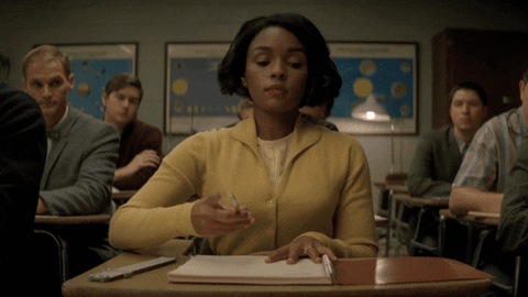 Janelle Monae spinning her pencil like a badass in a room full of intersectional haters.