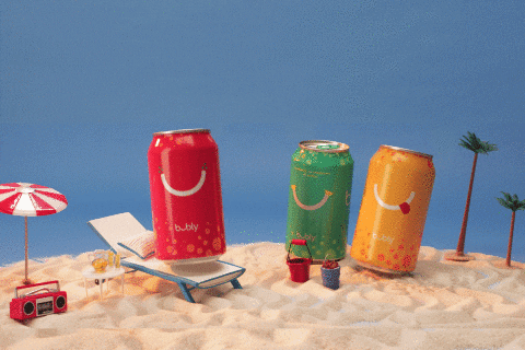 soda cans dancing on the beach