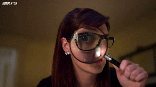 woman investigator with a magnifying glass