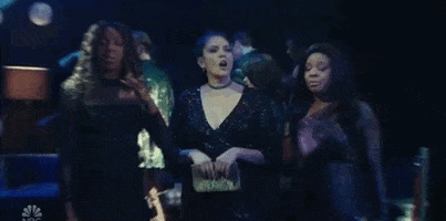 SNL gif. Cecily Strong, Ego Nwodim, and Punkie Johnson stand in a night club shaking their heads and hands with tired faces like they are totally done.