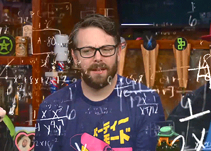 A man with a beard and glasses trying to math
