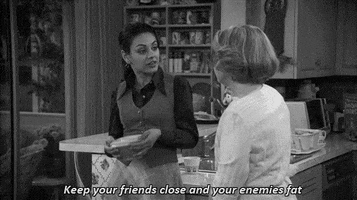 mila kunis keep your friends close and your enemies fat GIF