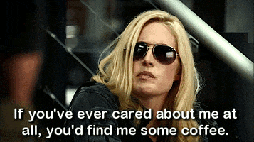 TV gif. Charlotte Sullivan as Gail in Rookie Blue looks up exhausted through dark aviator sunglasses. Text, "If you've ever cared about me at all, you'd find me some coffee."