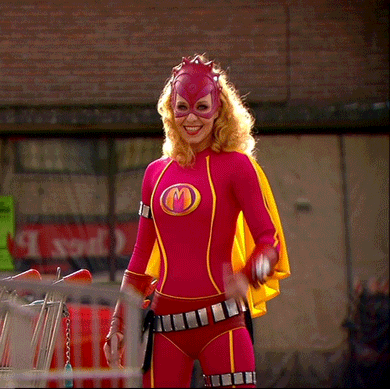 TV gif. Free Souffriau as super hero Mega Mindy smiles at us as she slowly gives a thumbs up.